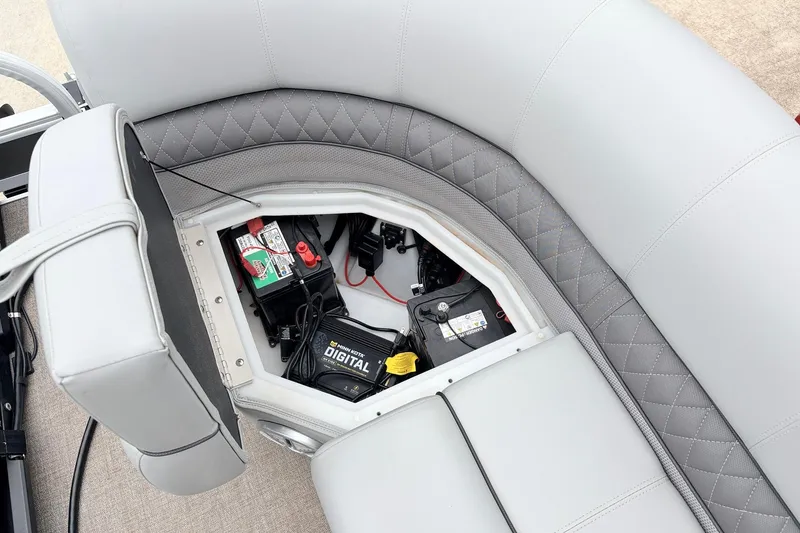 Slide: The Image of 2021 Ranger 223FC boat seat storage with battery and digital charger. - 18