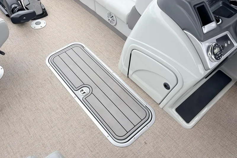 Slide: The Image of Interior of 2021 Ranger 223FC boat showing deck hatch and control panel. - 20