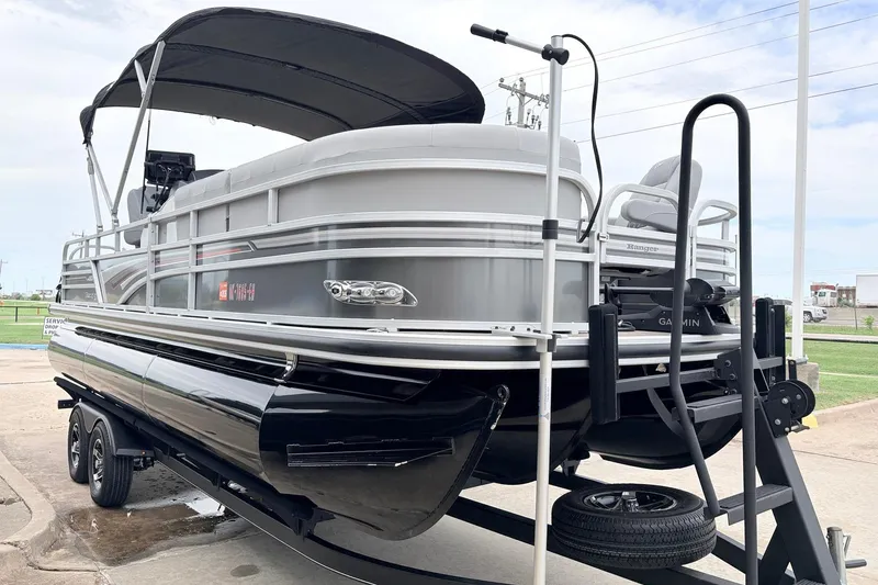 Slide: The Image of 2021 Ranger 223FC pontoon boat on trailer with canopy and Garmin equipment. - 4