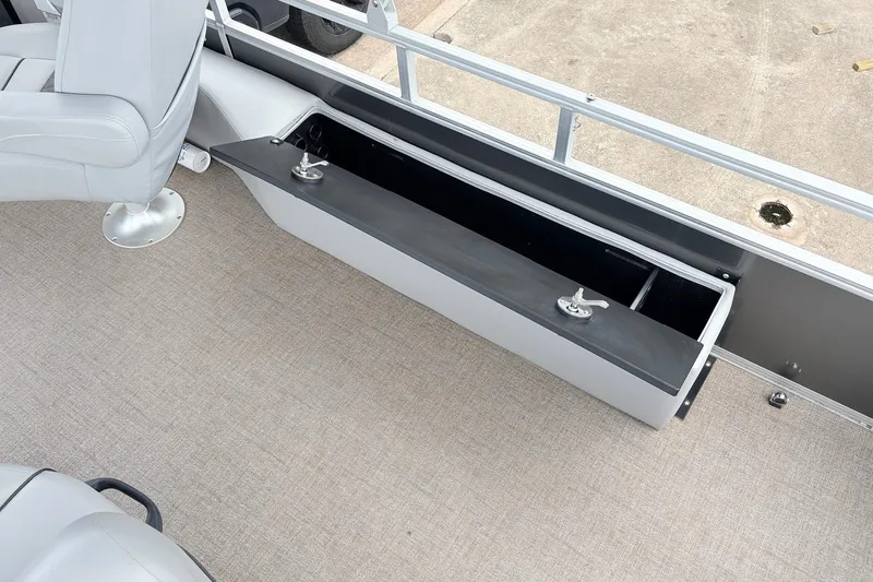 Slide: The Image of 2021 Ranger 223FC boat interior with storage compartment and seating. - 45