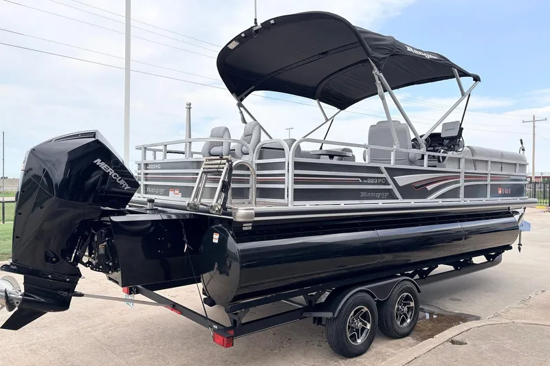 Slide: The Image of 2021 Ranger 223FC pontoon boat with Mercury outboard engine on trailer. - 5
