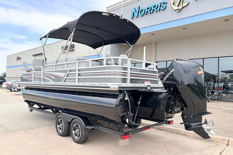 Slide: The Image of 2021 Ranger 223FC pontoon boat with Mercury engine at dealership. - 6