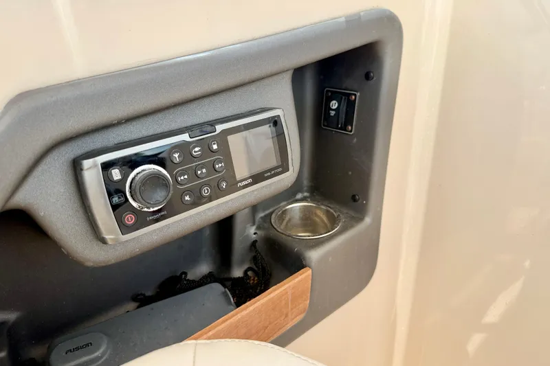 Slide: The Image of Control panel of a 2015 Grady-White Freedom 275 boat with Fusion stereo system. - 18