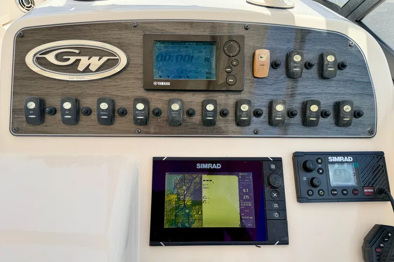 Slide: The Image of Control panel of a 2015 Grady-White Freedom 275 boat with Simrad electronics. - 19