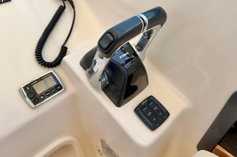 Slide: The Image of Control panel of a 2015 Grady-White Freedom 275 boat with Yamaha throttle. - 23