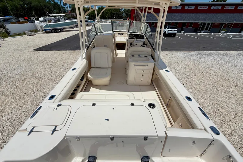 Slide: The Image of 2015 Grady-White Freedom 275 boat interior, featuring spacious seating and modern amenities. - 28