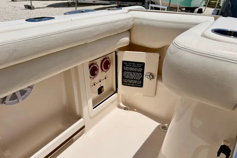 Slide: The Image of 2015 Grady-White Freedom 275 boat interior with dual battery switch panel. - 35