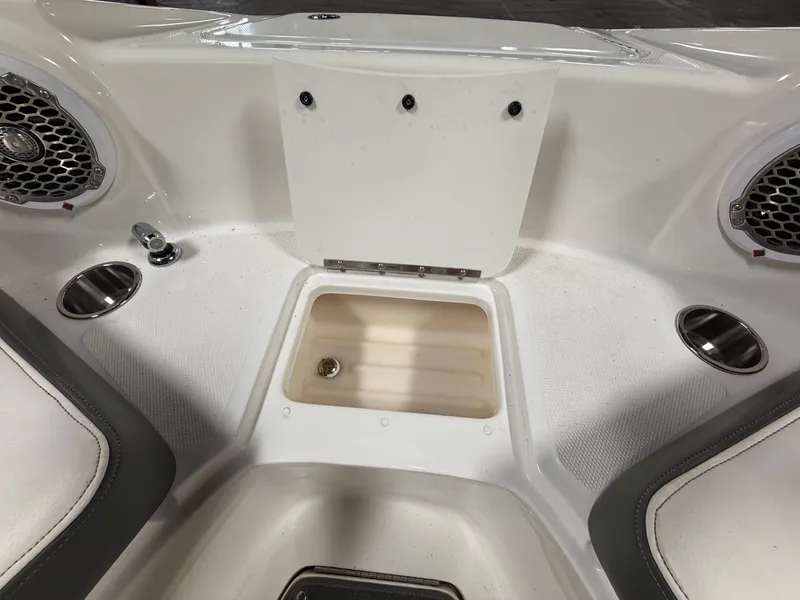Slide: The Image of Interior of 2012 Sea Ray 220 Sundeck with speakers and storage compartment. - 30