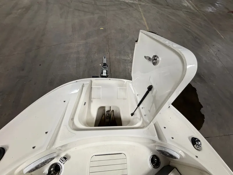 Slide: The Image of Open storage compartment on a 2012 Sea Ray 220 Sundeck boat. - 32