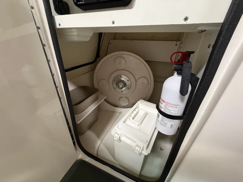 Slide: The Image of Interior of 2012 Sea Ray 220 Sundeck with fire extinguisher. - 38