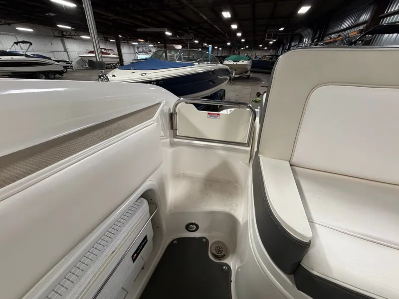 Slide: The Image of Interior of a 2012 Sea Ray 220 Sundeck in a storage facility. - 41