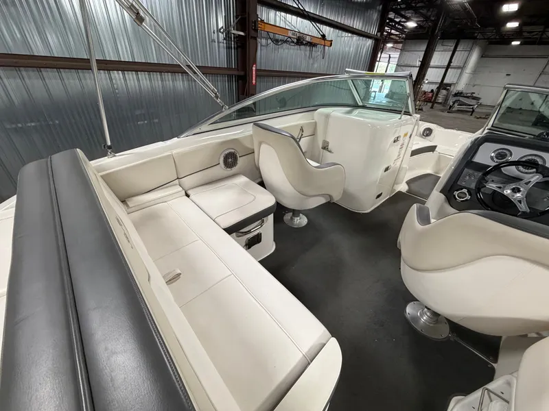Slide: The Image of Interior of a 2012 Sea Ray 220 Sundeck boat with seating. - 44