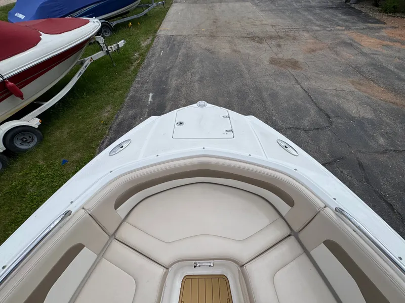 Slide: The Image of Front view of a 2011 Chaparral 246 SSi boat on a trailer. - 10