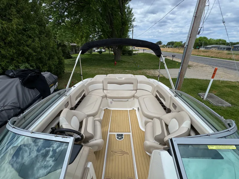 Slide: The Image of Interior view of a 2011 Chaparral 246 SSi boat with beige seating. - 12