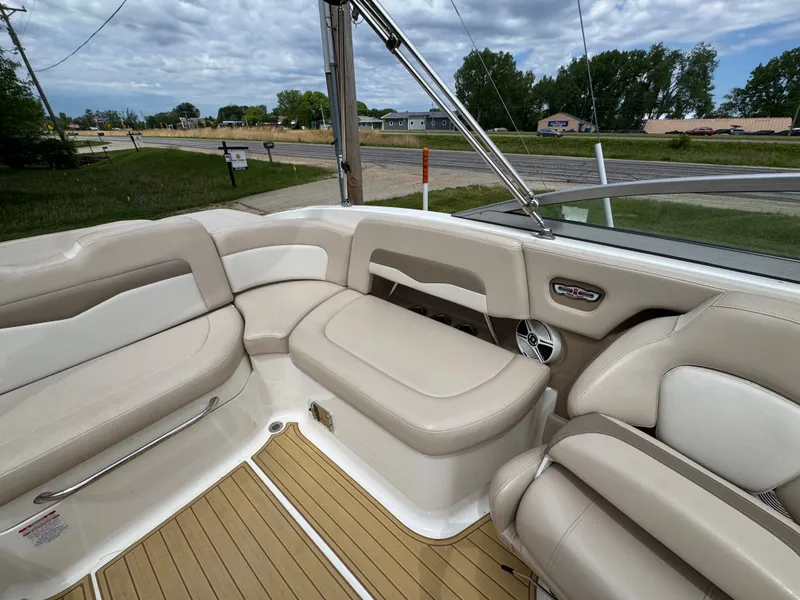 Slide: The Image of Interior of a 2011 Chaparral 246 SSi boat with beige seating. - 19