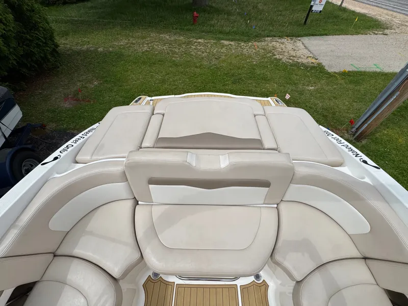 Slide: The Image of Interior of a 2011 Chaparral 246 SSi boat with beige seating. - 20