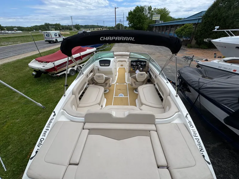 Slide: The Image of 2011 Chaparral 246 SSi boat with open deck and seating area. - 26