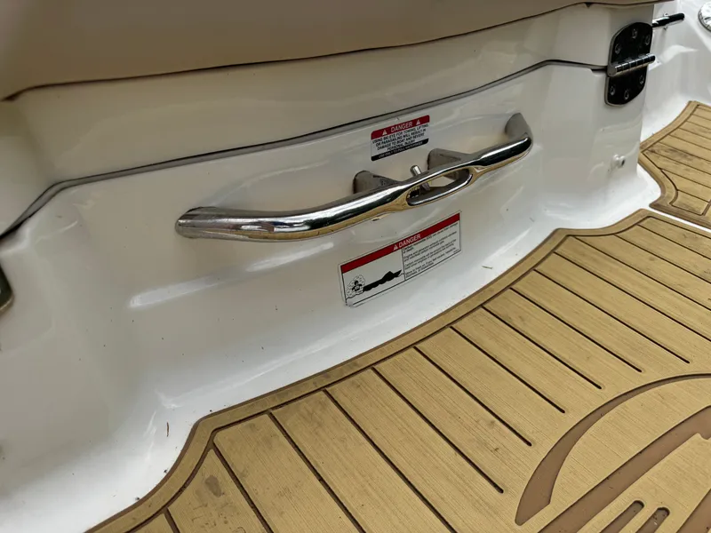 Slide: The Image of Chaparral 246 SSi 2011 boat rear with wood deck and handle. - 28