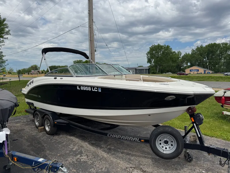Slide: The Image of 2011 Chaparral 246 SSi boat on trailer, parked outdoors. - 33