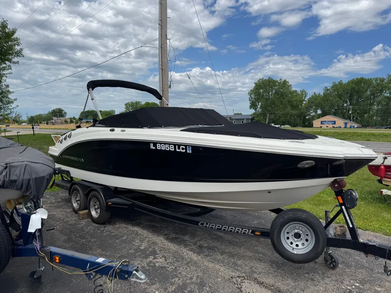 Slide: The Image of 2011 Chaparral 246 SSi boat on trailer under blue sky. - 34