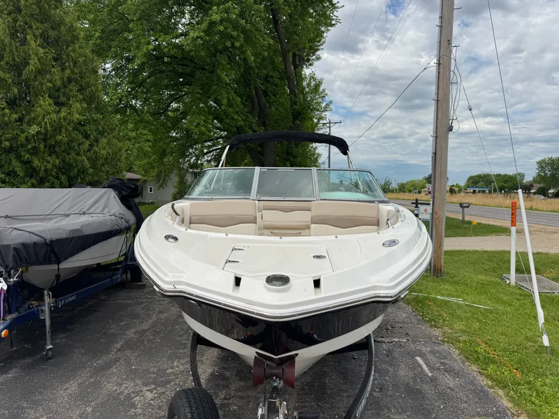 Slide: The Image of 2011 Chaparral 246 SSi boat parked on a trailer. - 35