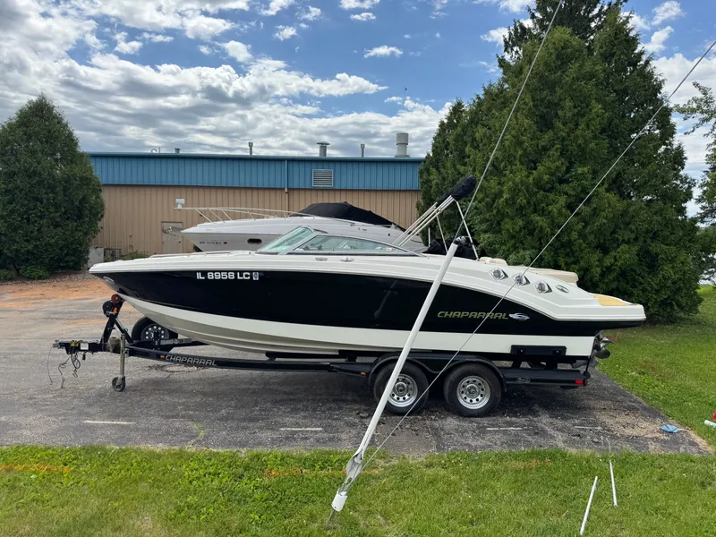 Slide: The Image of 2011 Chaparral 246 SSi boat on trailer in front of warehouse. - 36