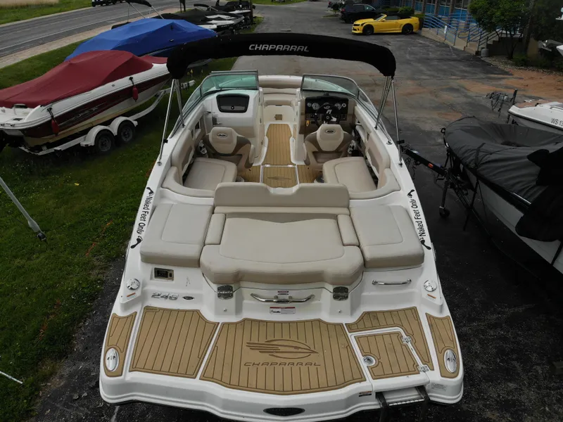 Slide: The Image of 2011 Chaparral 246 SSi boat with luxurious interior and wood accents. - 6