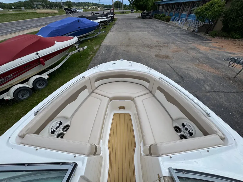 Slide: The Image of 2011 Chaparral 246 SSi boat with beige interior and speakers. - 9