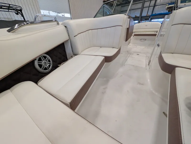 Slide: The Image of Interior of a 2011 Cobalt 242 boat with white seating. - 14