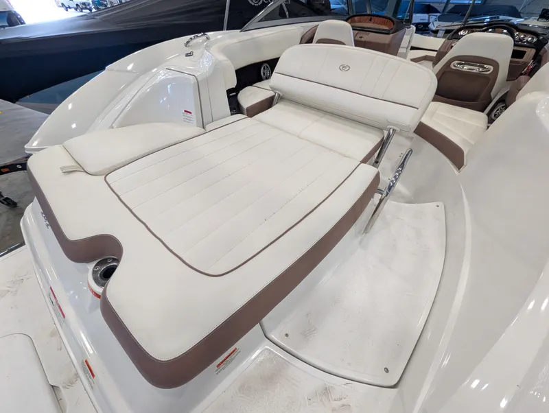 Slide: The Image of Interior of a 2011 Cobalt 242 boat with white upholstery. - 17