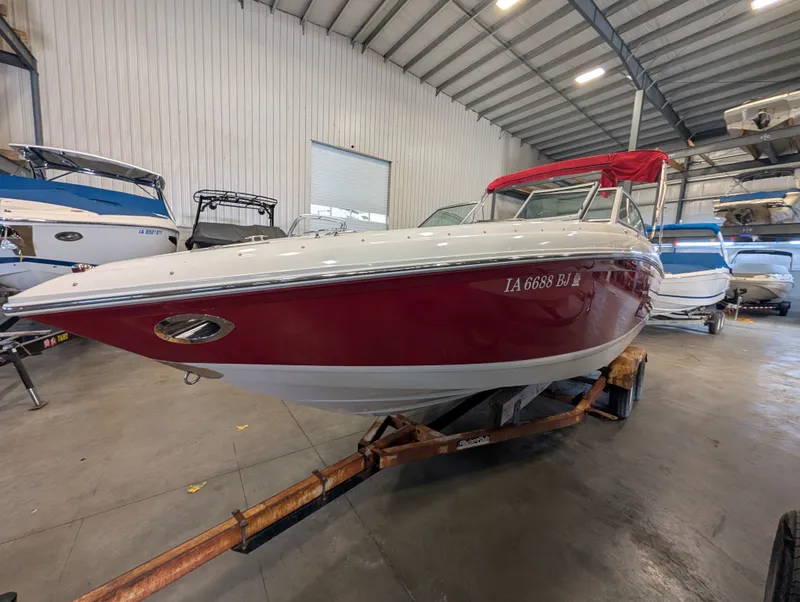 Slide: The Image of 2011 Cobalt 242 boat in warehouse on trailer. - 3