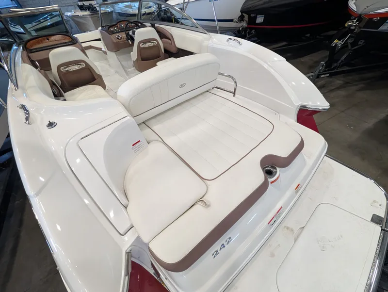 Slide: The Image of Interior of a 2011 Cobalt 242 boat with white seating. - 7