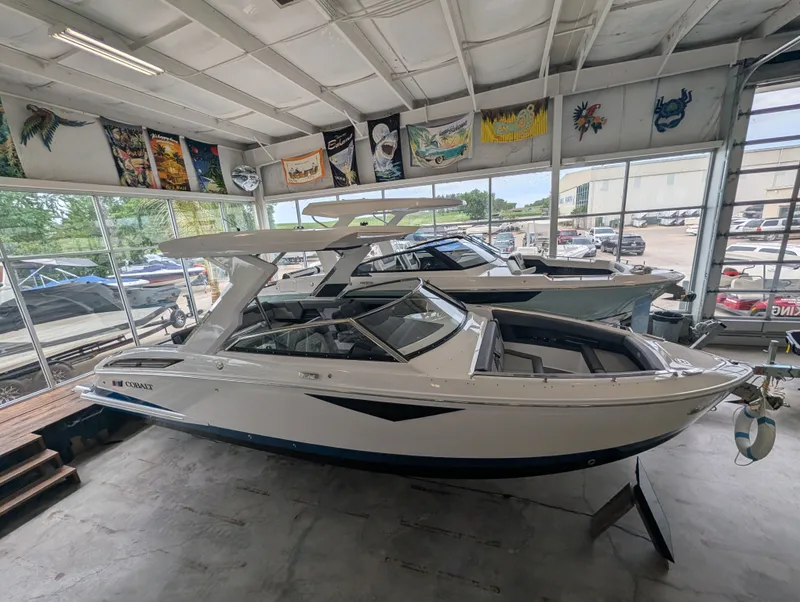 Slide: The Image of 2026 Cobalt A29 boat displayed in showroom. - 10