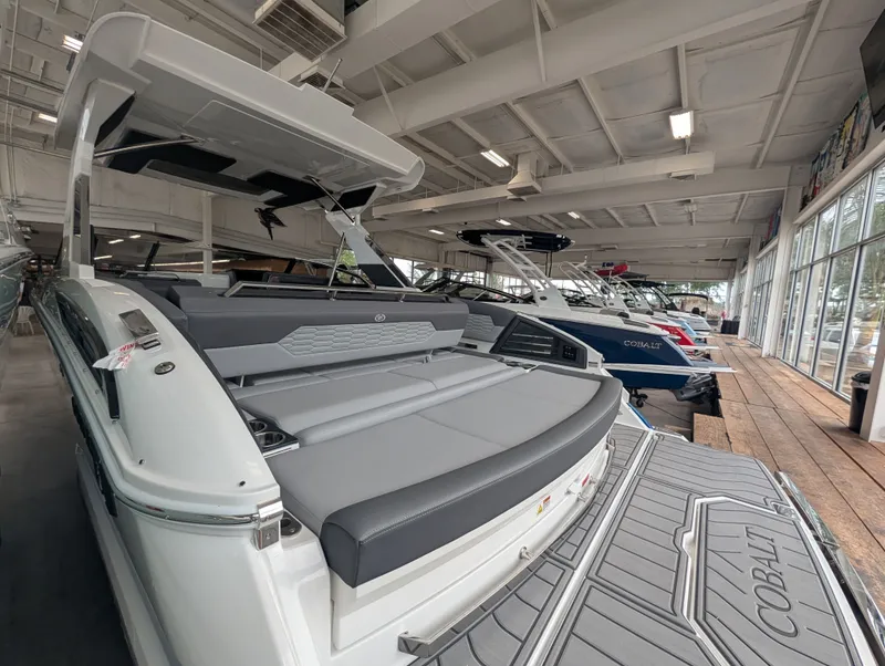 Slide: The Image of 2026 Cobalt A29 boat displayed in showroom. - 12