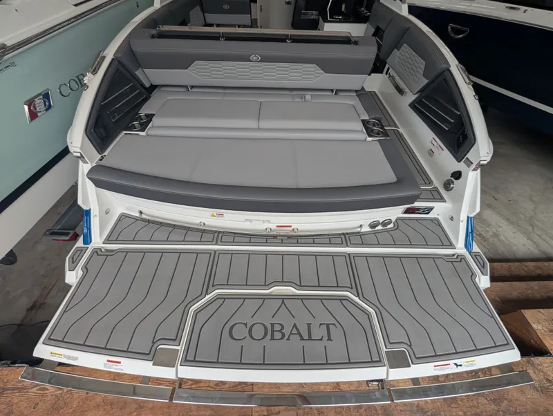 Slide: The Image of Rear view of 2026 Cobalt A29 boat with gray upholstery. - 13