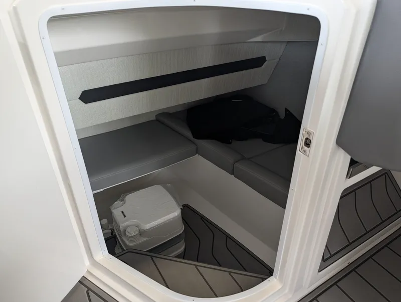 Slide: The Image of Interior of 2026 Cobalt A29 yacht with seating area and toilet. - 21