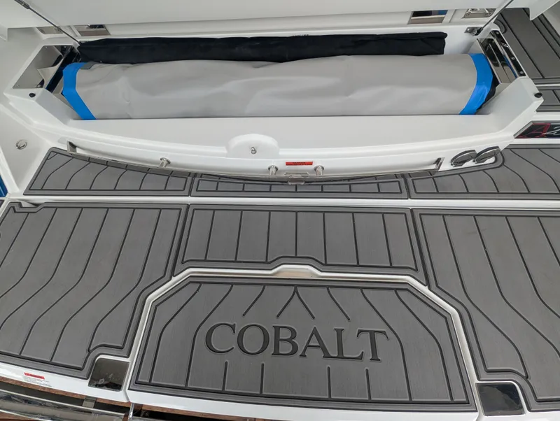 Slide: The Image of Cobalt A29 2026 boat with gray deck and storage compartment. - 25