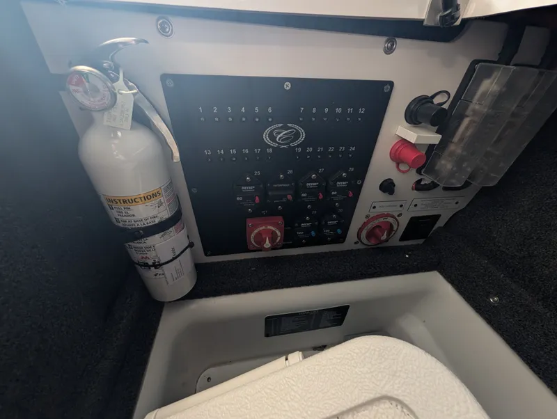Slide: The Image of Cobalt A29 2026 boat control panel with fire extinguisher and switches. - 28