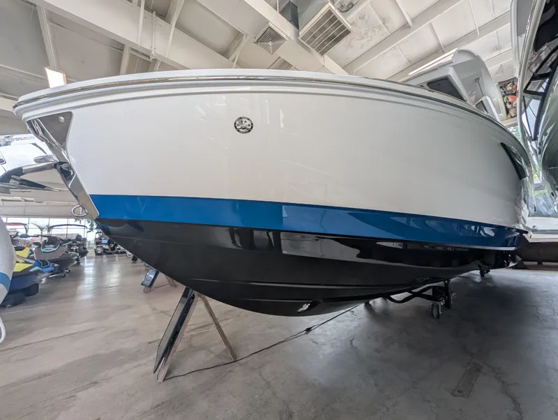 Slide: The Image of 2026 Cobalt A29 boat in showroom, side view. - 3