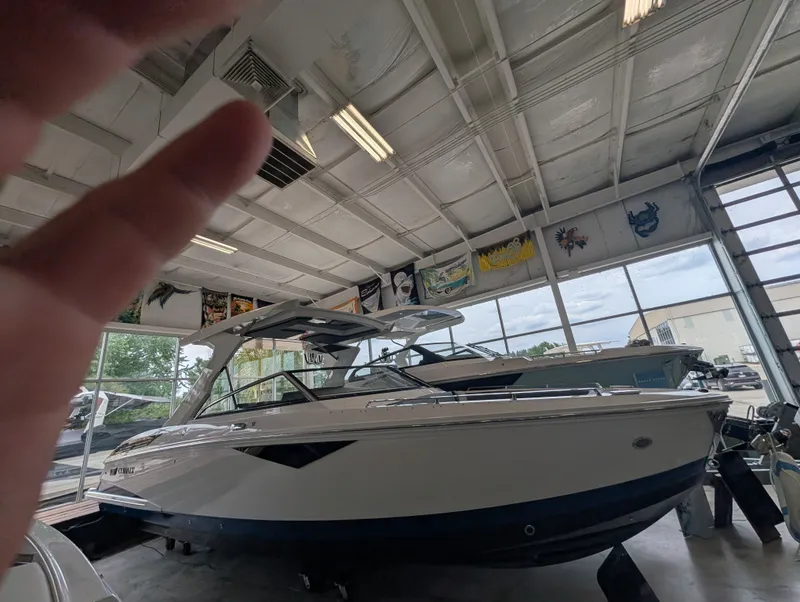 Slide: The Image of 2026 Cobalt A29 boat in a showroom. - 5