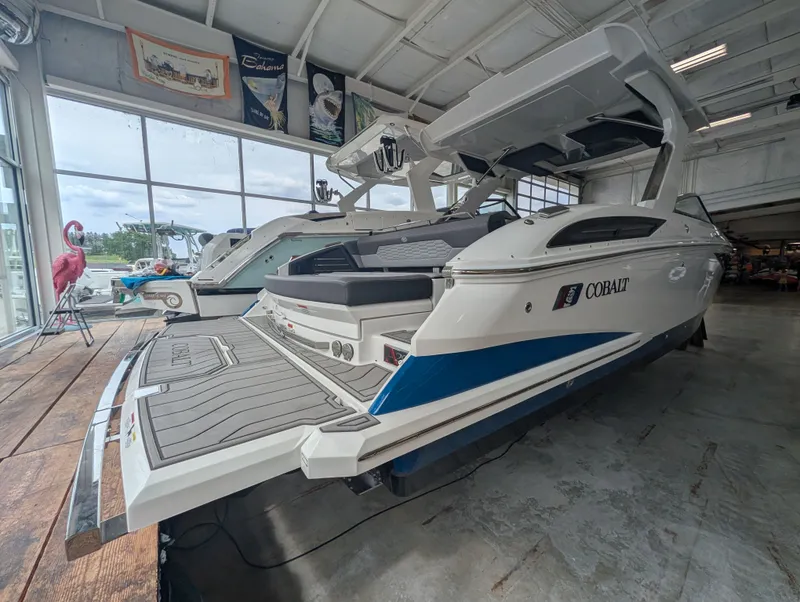 Slide: The Image of 2026 Cobalt A29 boat in showroom, modern design. - 6