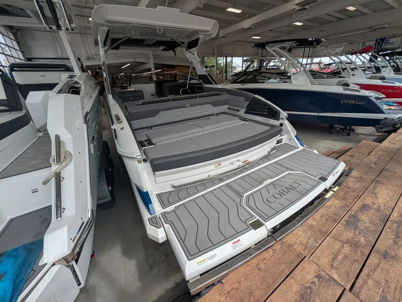 Slide: The Image of 2026 Cobalt A29 boat in showroom, luxurious design. - 7
