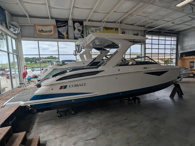 Slide: The Image of 2026 Cobalt A29 boat displayed in a showroom. - 9