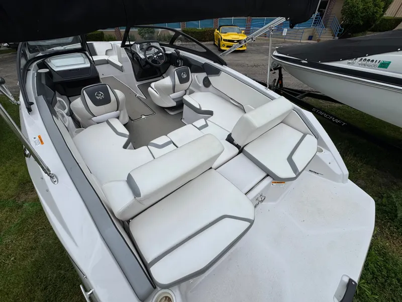 Slide: The Image of Interior of a 2017 Scarab SB 195 JET boat with white seating. - 16