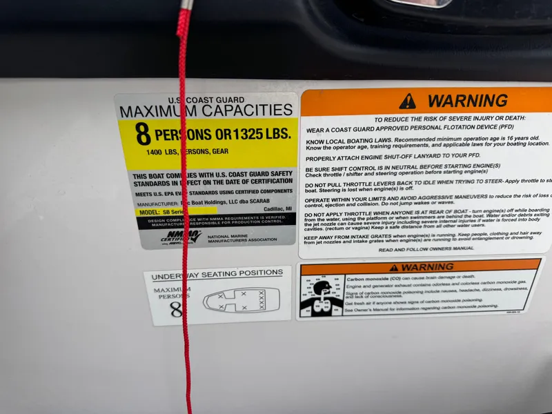Slide: The Image of Safety and capacity labels on a 2017 Scarab SB 195 JET boat. - 18