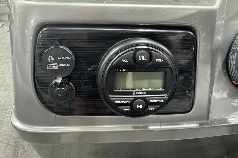 Slide: The Image of Control panel of a 2018 Lowe SF 214 Sport Fish with JBL audio system and inputs. - 10