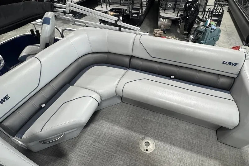 Slide: The Image of 2018 Lowe SF 214 Sport Fish boat interior with gray cushioned seating. - 12