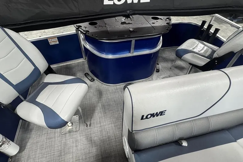 Slide: The Image of Interior of a 2018 Lowe SF 214 Sport Fish boat with seating and fishing station. - 13