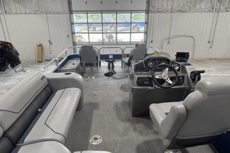 Slide: The Image of Interior of a 2018 Lowe SF 214 Sport Fish boat with seating and control console. - 14