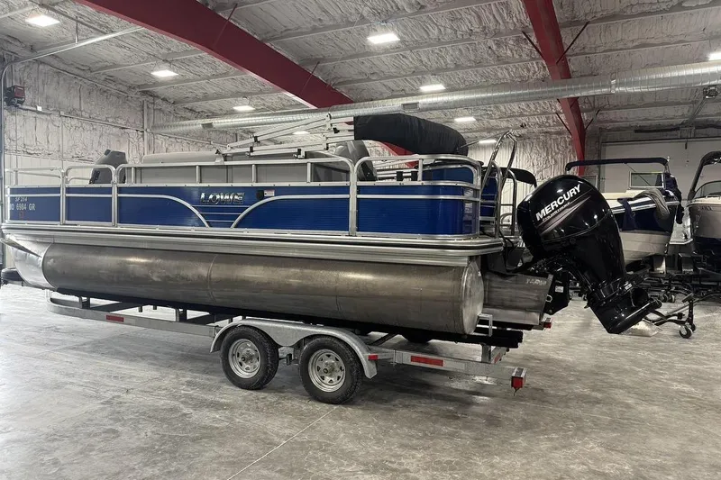 Slide: The Image of 2018 Lowe SF 214 Sport Fish pontoon boat with Mercury outboard in a warehouse. - 4